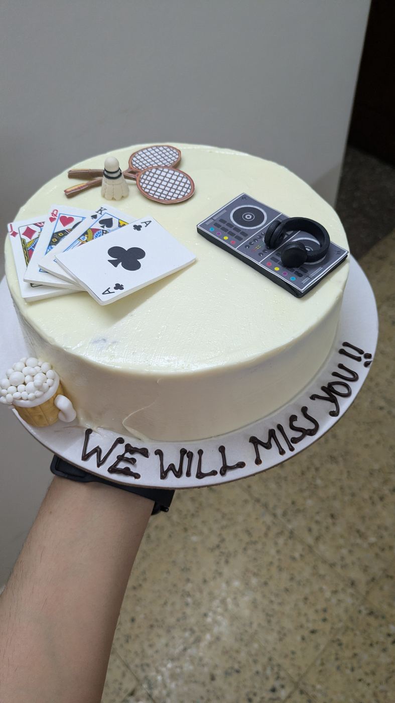 Farewell cake with card and DJ decorations