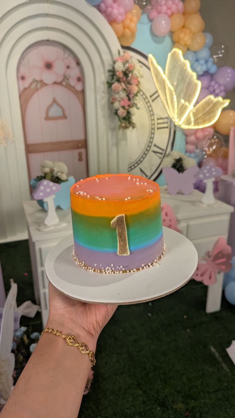 Rainbow ombre first birthday cake